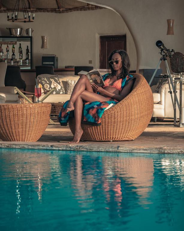 Olarro Plains safari lodge med vidsträckt utsikt över Maasai Maras savann, pool och lyx