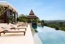 Infinitypool med panoramautsikt över grönskande landskap vid lyxvilla på Anantara Layan Phuket Resort i Thailand