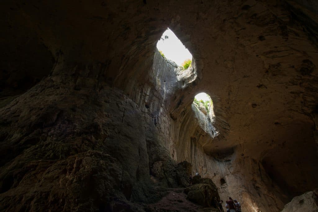Prohodna Cave God's Eyes natural rock formation with skylights in Bulgaria near Karlukovo